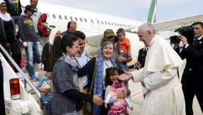 Pope Francis hosts Syrian refugees for lunch at his private residence