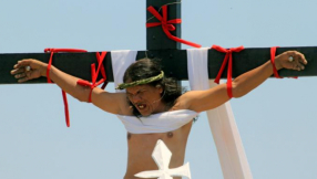 Devout Christians in the Philippines literally nail themselves to the cross in Good Friday re-enactment