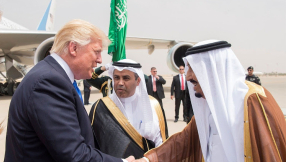 Trump arrives in Saudi Arabia as James Comey firestorm continues in US