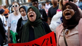 Anger turns to rage as police escort Theresa May from Grenfell Tower protestors