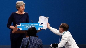 Tearful Theresa May battles protester and coughing fits to outline 'the British dream'