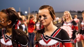 Cheerleaders win legal battle against atheist group who wanted to stop them writing Bible verses on their banners