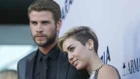 Miley Cyrus and Liam Hemsworth news: Singer gets two new tattoos; couple's families not 'urging' them to have a baby