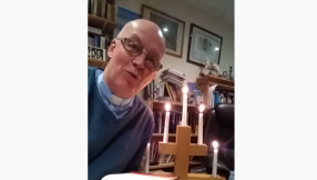 Vicar accidentally sets himself on fire during online service