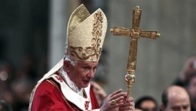 Catholic faithful praying for Pope Emeritus Benedict XVI