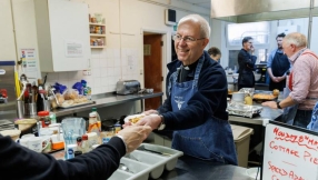 Archbishop of Canterbury serves at homeless charity for the Big Help Out 