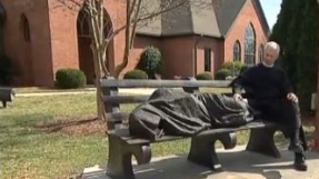 \'Homeless Jesus\' statue sleeping on a park bench in North Carolina sparks controversy [video]