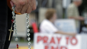 Pastor sues after he was arrested for protesting abortion