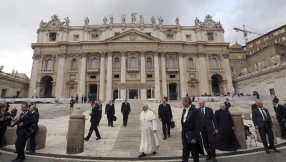 Topless Femen protesters deface crucifixes outside Vatican in lewd protest against the Pope