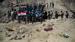 Forensic teams dig up mass graves of ISIS victims in Tikrit