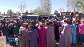 Polygamous cult members rally to stop mother from rescuing her children