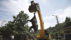 Georgia church blames killer floods on ex-communist rulers who melted church crosses, bells to build zoo