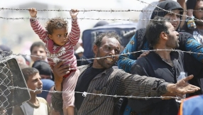 60,000 flee Syrian city as ISIS militants attack; help sought for people still inside