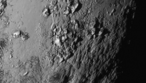 Pluto\'s smooth surface, moon Charon\'s geographical features baffle scientists