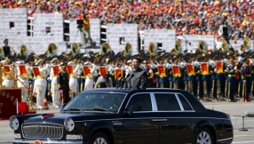 China parades military strength but pledges 300,000 troops cut