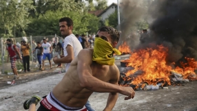 Hungarian riot police detain migrants, including \'terrorist\'