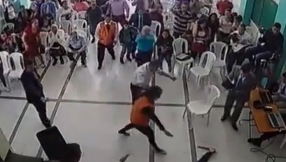 Divine intervention: \'Invisible force\' knocks down man about to stab priest inside church in Colombia