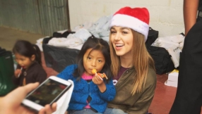 Sadie Robertson literally follows \'footsteps\' of her parents by handing out rain boots to poor Guatemala kids