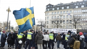 Masked mob threatening migrants go on the rampage in Stockholm