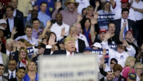 Trump asks backers to swear their support amid taunts by protesters in Florida rally