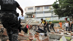 \'We seek the hand of God\': Ecuador death toll rises as rescuers pick through the rubble