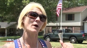 Woman wearing burqa attacks family with American flag for no apparent reason