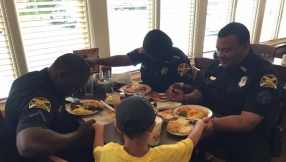 \'Act of love\' amid violence: 6-year-old boy asks police officers to pray with him for their safety