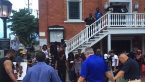 Suddenly, black and white Americans are praying together, hugging each other and breaking racial barriers after Dallas