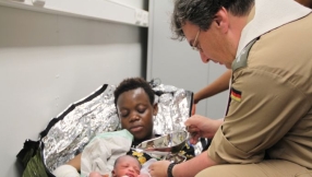 Baptism on board as refugee mother gives birth on naval ship