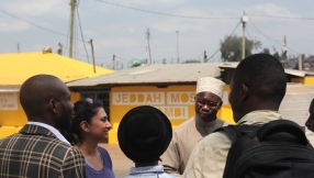 Why are Kenyan churches and mosques being painted yellow?