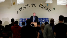 Trump interrupted by pastor as he uses church address to attack Clinton