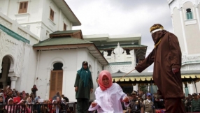 Woman Caned in Public for Standing Too Close to Her Boyfriend in Violation of Indonesia\'s Harsh Sharia Law